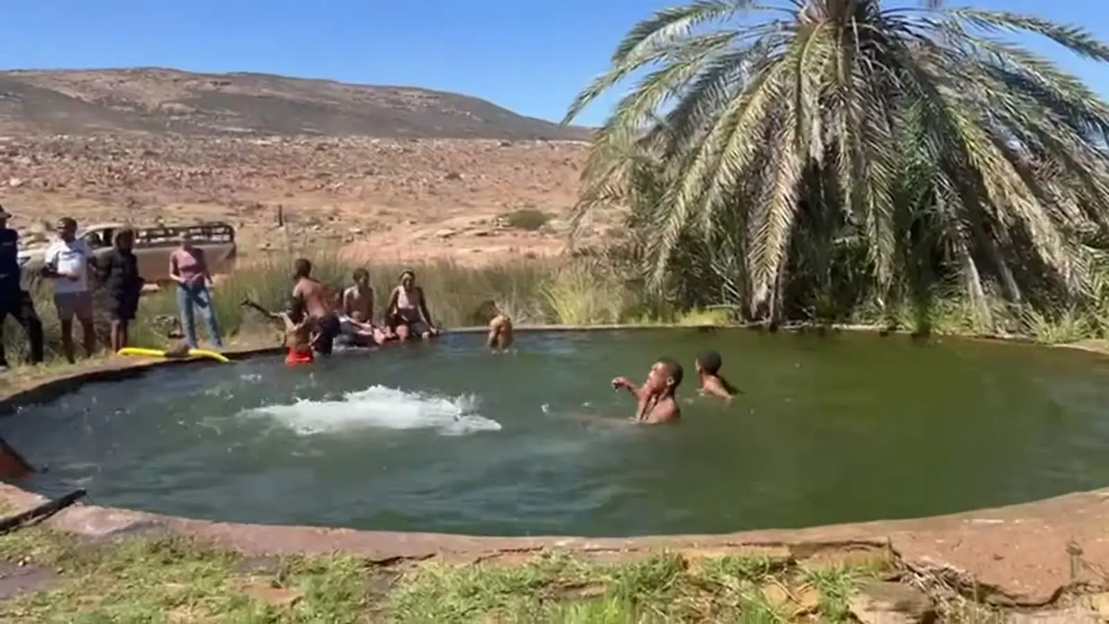 Campers playing in the pool at Kookfontein