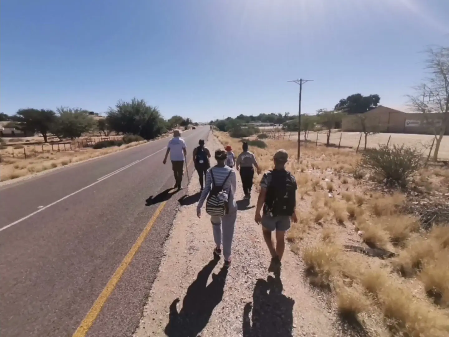 Hikers walking together along a road near Kakamas