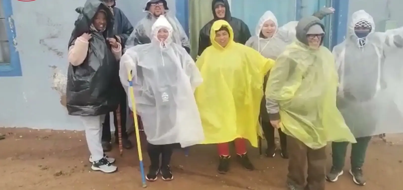 Hikers in rain ponchos before a walk through the Kammiesberg
